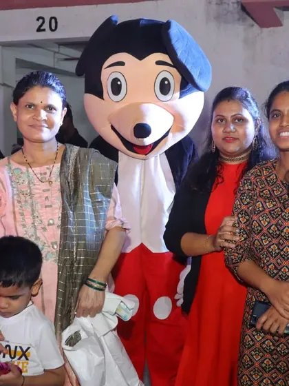 Our Mickey Mouse mascot posing with guests at a birthday party. Mascots are a great way to create fun photo opportunities for everyone.