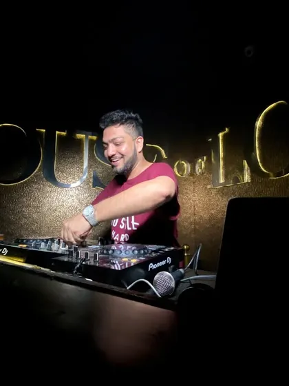 In my favorite place, on the decks at House of Lords. This is where I feel most at home, surrounded by music and good energy.