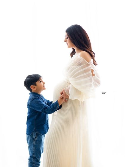 A tender moment between a mamma and her son. The way he looks up at her is just priceless.