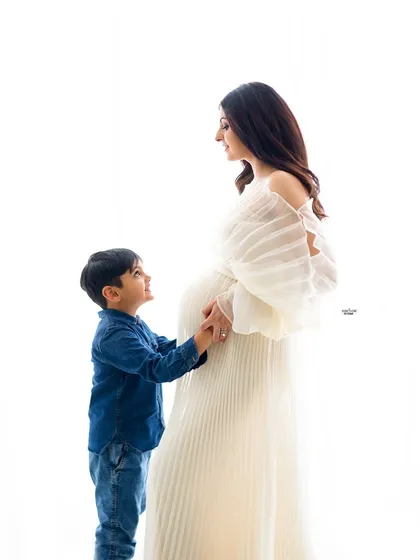 A tender moment between a mamma and her son. The way he looks up at her is just priceless.