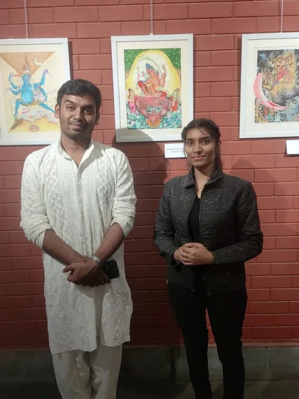 With a visitor at my art exhibition. I am always grateful for the opportunity to discuss the minute details and stories embedded within each painting, making the experience more enriching for art lovers.