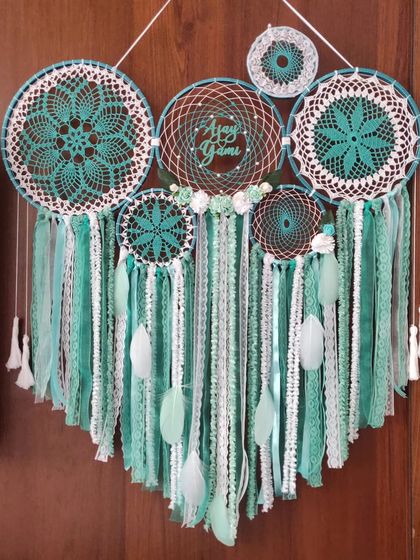 Elevate your space with our Mint Green Cluster Dreamcatcher. Crafted to capture serenity, its aesthetic appeal transforms any room into a haven of peace.