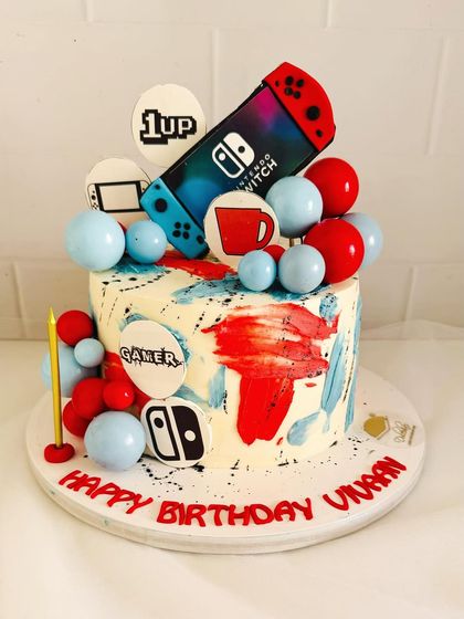 A fun and colorful Nintendo Switch cake for a gamer's birthday.