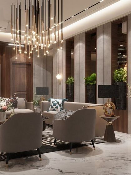 We designed this private family sitting area as an intimate and moody retreat. The space combines dark wood paneling, a dramatic waterfall chandelier, and plush seating to create a cozy yet sophisticated environment for close family moments.