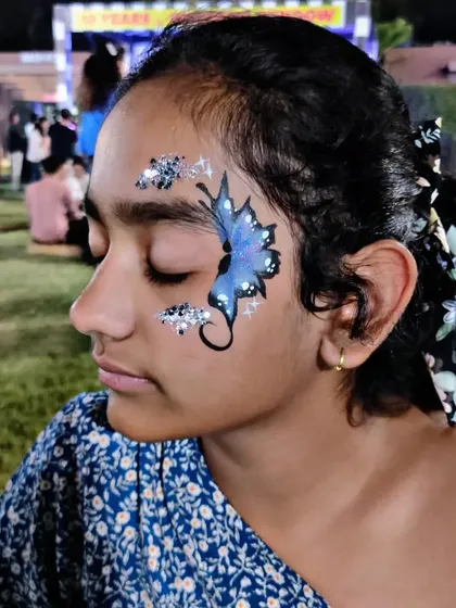A beautiful blue butterfly design with a trail of sparkling silver glitter.