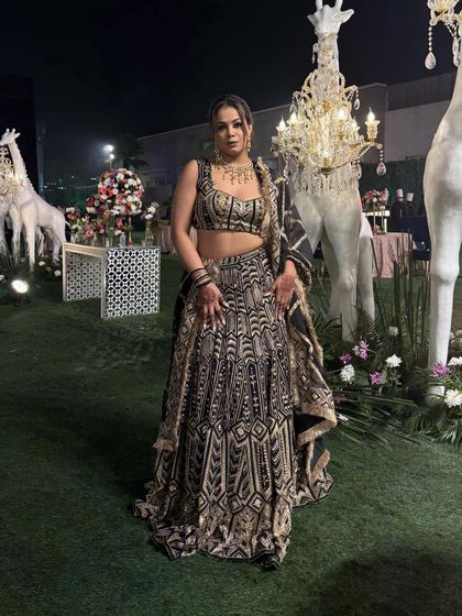 Posing against the beautiful decor, this lehenga truly shines. It's a perfect example of royal wedding attire for a host.