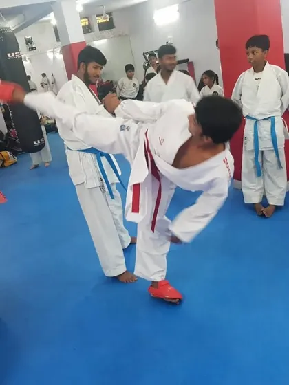 A student executes a powerful kick during a drill at the seminar, putting new learnings into practice.