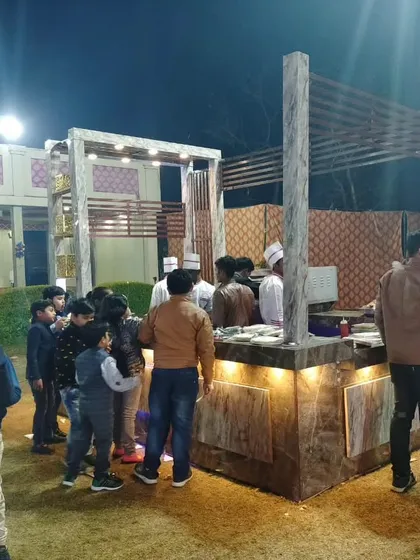 Guests gathering around the live food counter to watch the preparation and enjoy the food. This shows how my live stations become a popular hub at any event.