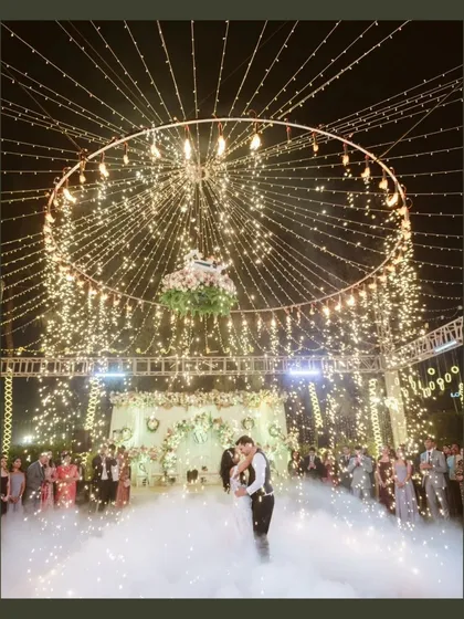 A first dance under a canopy of fairy lights and fireworks. We specialize in capturing these magical, cinematic moments that feel like they're straight out of a movie.