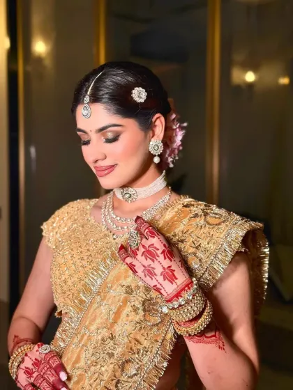 A symphony of tradition and luxury. I styled this golden lehenga with a delicate diamond choker and matching earrings for a sophisticated and elegant bridal look.