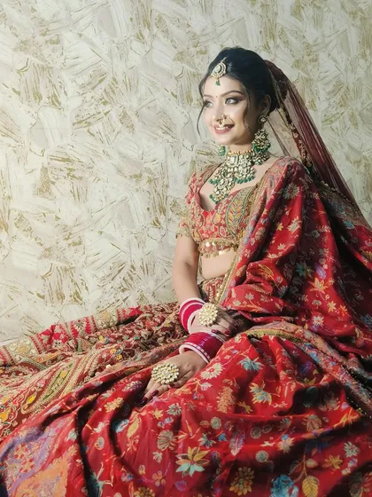 A happy bride enjoying her moment in our maroon paisley lehenga. The full flare of the skirt is truly impressive.