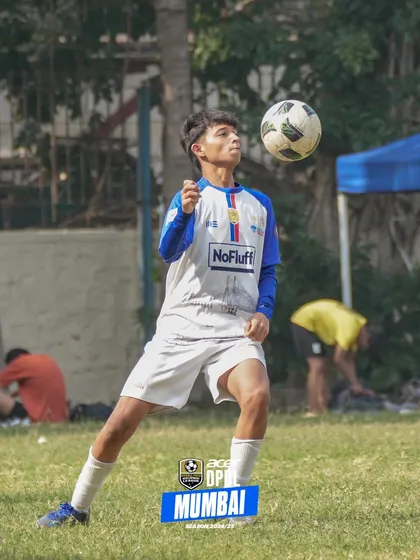 A player controls the ball with his chest, demonstrating the technical skills we emphasize from a young age. Our players are comfortable and confident on the ball.