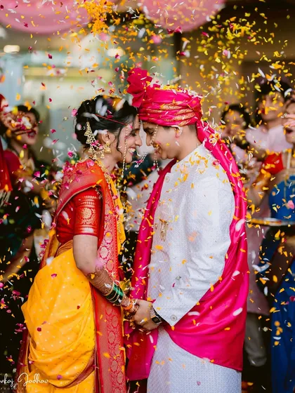 A shower of petals and blessings. This single frame from Ravija and Samarth's Mumbai wedding is bursting with the joy and energy of the Varmala ceremony, a moment of pure celebration.