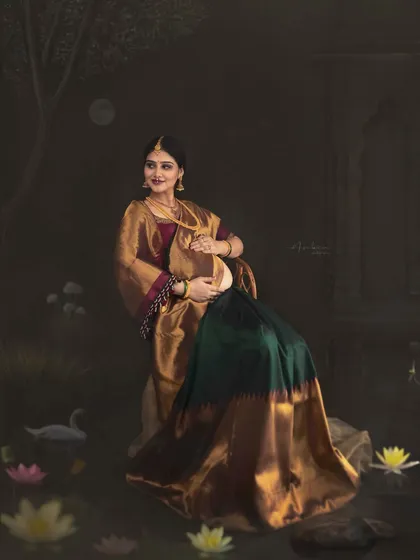 A full-view portrait set against a custom-painted backdrop of a moonlit pond. This frame shows my ability to create a complete, immersive world for your maternity story, blending art, culture, and photography.