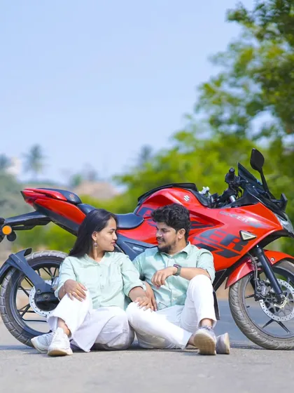 A cool and relaxed pose with a red sports bike. This is a great shot for couples who want an adventurous, modern pre-wedding album.