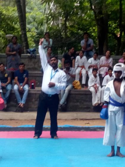 The referee declares the winner of the bout. This moment is the culmination of hard training and courage.