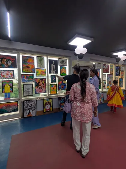Our faculty engaging with parents and students, discussing the artworks on display. The exhibition is a wonderful opportunity for interaction and feedback within our supportive community.