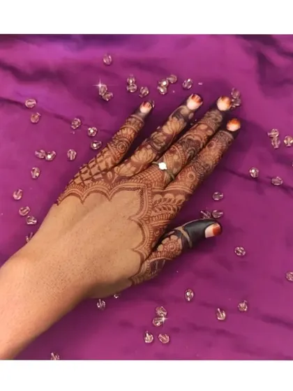 A classic party design with a scalloped edge at the wrist and detailed work on each finger.