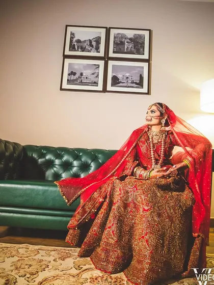 A professionally shot photo of a bride on her wedding day. Her mehndi is a key part of her stunning bridal portrait.