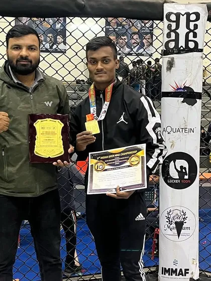 Our fighter with his gold medal and a plaque at the Indian Open. Hard work pays off.