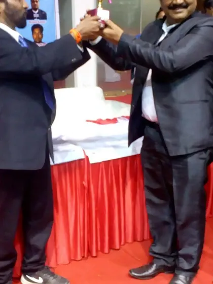 Our instructors receiving an award at a national karate championship, recognizing their contribution to the sport.