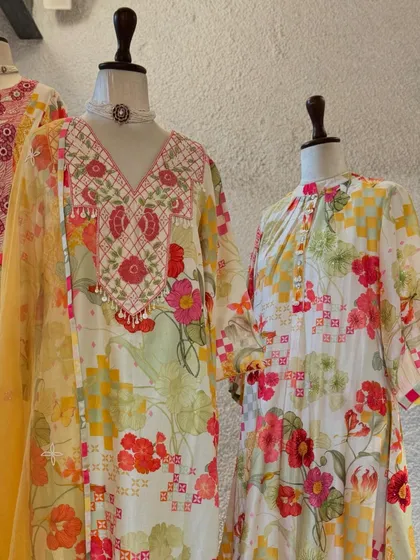 Another view of the floral printed suits, highlighting the fresh and vibrant patterns perfect for a daytime festive event.