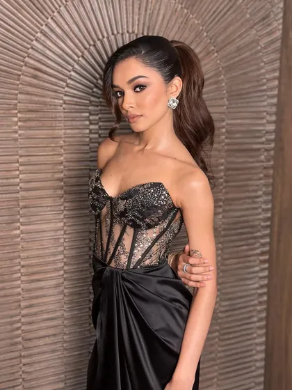 Another angle of this dramatic evening look. The makeup is designed to look flawless from every angle, with a focus on creating a sculpted and defined silhouette.