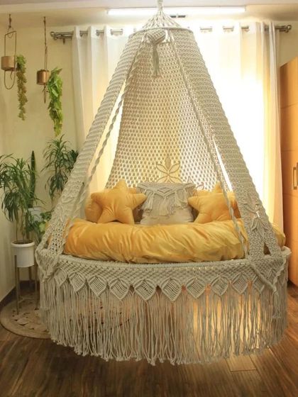 This view highlights the star-shaped pillows and the deep, comfortable mattress of our handmade bed swing. It's ready for you to curl up and relax.