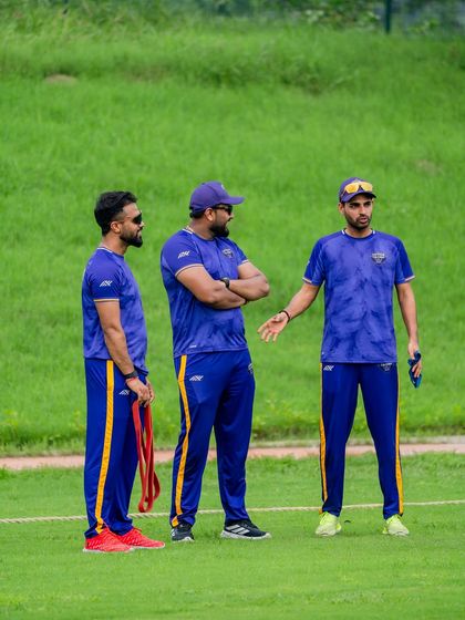 A moment of discussion and strategy on the field with the team. My role involves constant communication to ensure the physical preparation aligns with the team's game plan.