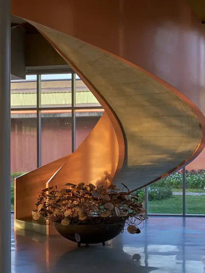 A sculptural spiral staircase, showcasing the interplay of form, material, and light within one of our projects. This detail shot emphasizes our focus on craftsmanship and creating expressive architectural moments that elevate the user experience.