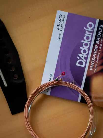 A close-up of the new D'Addario phosphor bronze strings. The right strings are key to getting a warm, balanced acoustic tone.