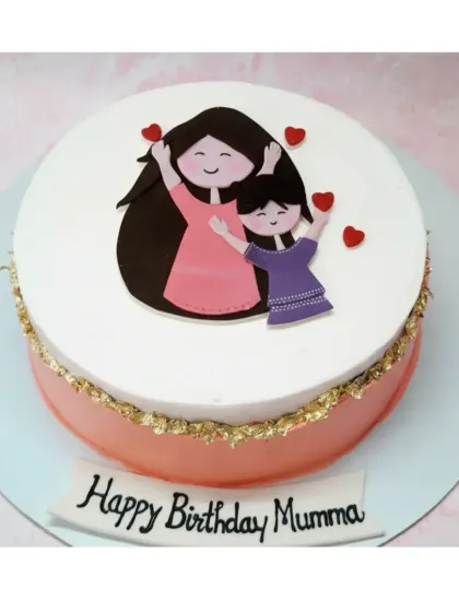 A sweet cake for "Happy Birthday Mumma". This choco-vanilla cake features a simple design with a mother and son topper and a touch of gold leaf.