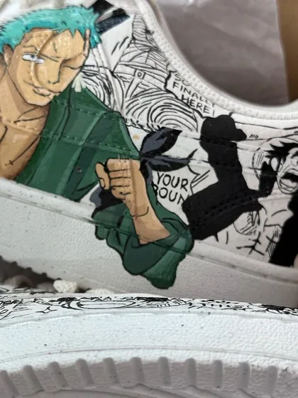 A close up of the Zoro side of the One Piece custom Nikes, showing the fine details of the manga panel background.
