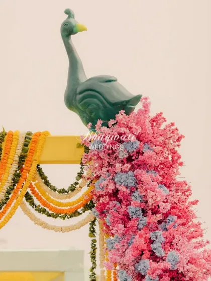 A close-up of the peacock's head and neck from the floral installation. This detail shows the craftsmanship involved in creating such a unique and beautiful decor piece.