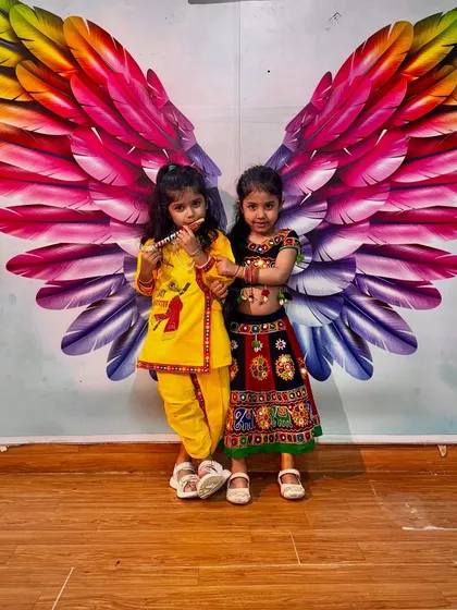 Another adorable Krishna and Radha pair, with one playing the flute. We love seeing our students embrace their roles with such joy.