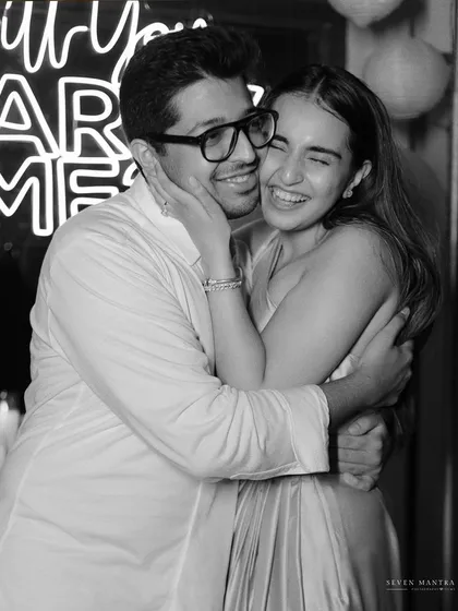 The pure, unadulterated joy right after she said yes. This black and white photo captures the overwhelming happiness and relief of a successful surprise proposal.