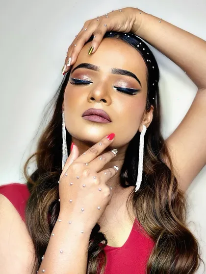 A closed-eye shot of the cocktail look, showcasing the blended eyeshadow and the clean lines of the winged liner.