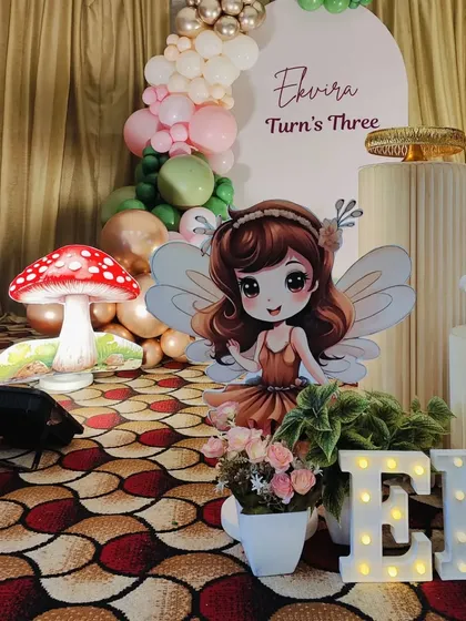 A shot focusing on the fairy cutout and the light-up name props for Ekvira's party.