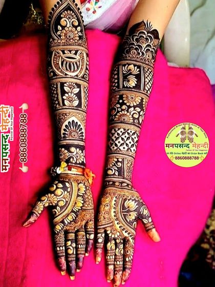 A beautiful design featuring a mix of lotuses and traditional Indian motifs. The use of dark and light shading gives the design a wonderful depth.