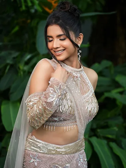 Another angle of this stunning dusky glam look. The focus is on creating a flawless, luminous base that celebrates the skin's natural tone, paired with a soft, nude-brown lip.