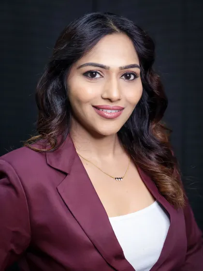 Another professional headshot, this time with a warm smile. It's a perfect, friendly-yet-professional look for any corporate use.