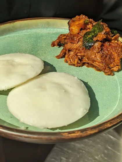 Vatteyappam is a steamed rice and coconut cake that is traditionally made as a round cake. I make mine in an idli mould for convenience, and it pairs wonderfully with my melt-in-your-mouth Kerala Chicken Roast.
