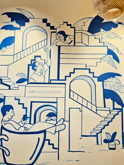 We love helping businesses tell their story. This custom doodle mural for a cafe uses minimalist line art to create a playful and engaging atmosphere that reflects the brand's unique character.