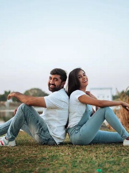 A slightly different take from the lakeside shoot, this one more posed but still relaxed and happy. The natural setting and casual denim outfits make this style of pre-wedding photography feel approachable and fun.