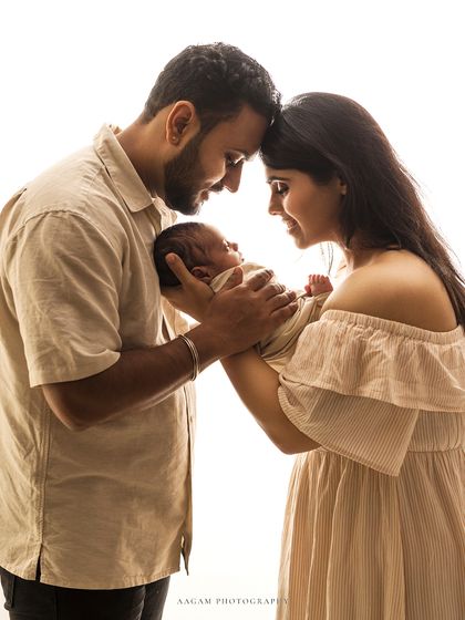In safe hands. A beautiful high-key family portrait, full of light and love.