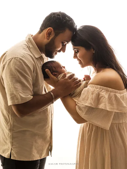 In safe hands. A beautiful high-key family portrait, full of light and love.