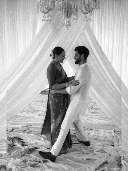 Sonakshi and Zaheer share a dance in this beautiful analog film portrait. The black and white medium adds a timeless, classic feel, focusing on their movement and connection.