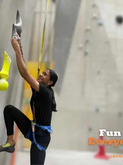 We believe climbing is fun for everyone. This climber enjoys one of the auto-belay routes, perfect for a solo session.