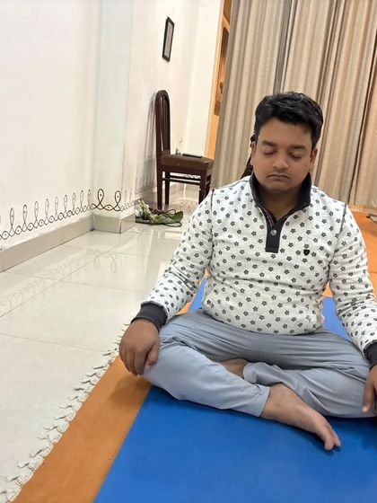 A participant sits in a meditative posture during the Surya Kriya practice, embracing the stillness that it brings.