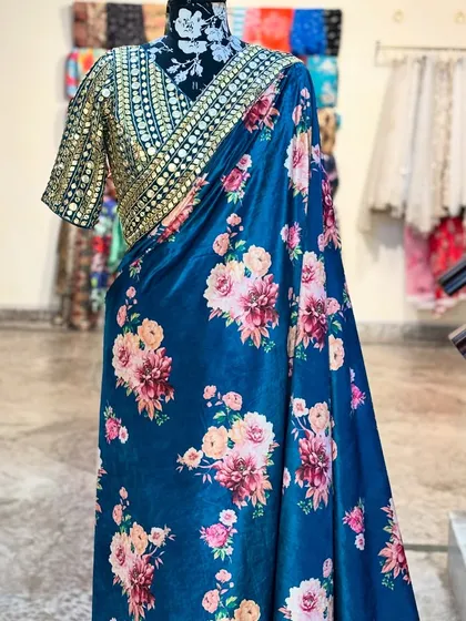 This view showcases the rich colors of the 'NIKHAAR' saree. It's a perfect example of how we blend traditional motifs with modern aesthetics.